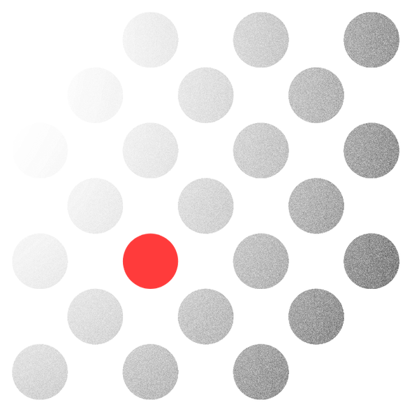 Office interior with several people working at computers; a wall with green plants and a company sign is visible.