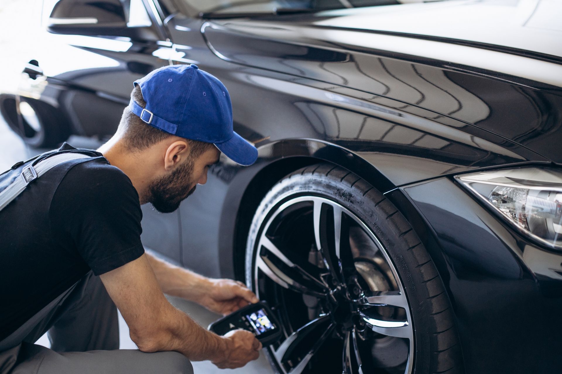 Repairman checking pressure sensors with a special tool