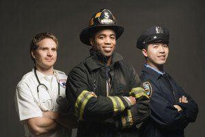 Doctor, firefighter, and police officer standing next to eachother