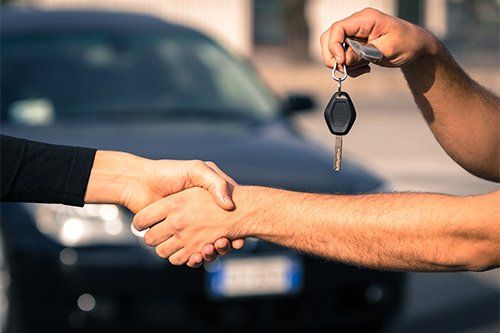Handing Car Key To New Owner