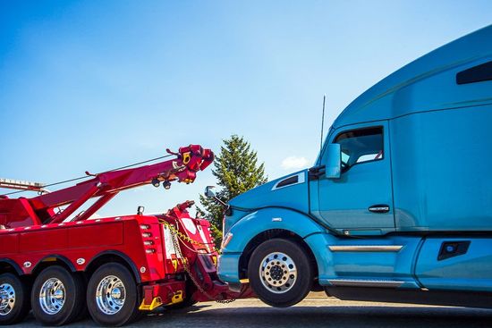 Truck Carrier with Mini Vans on Road — Haltom City, TX — AA Wrecker Service