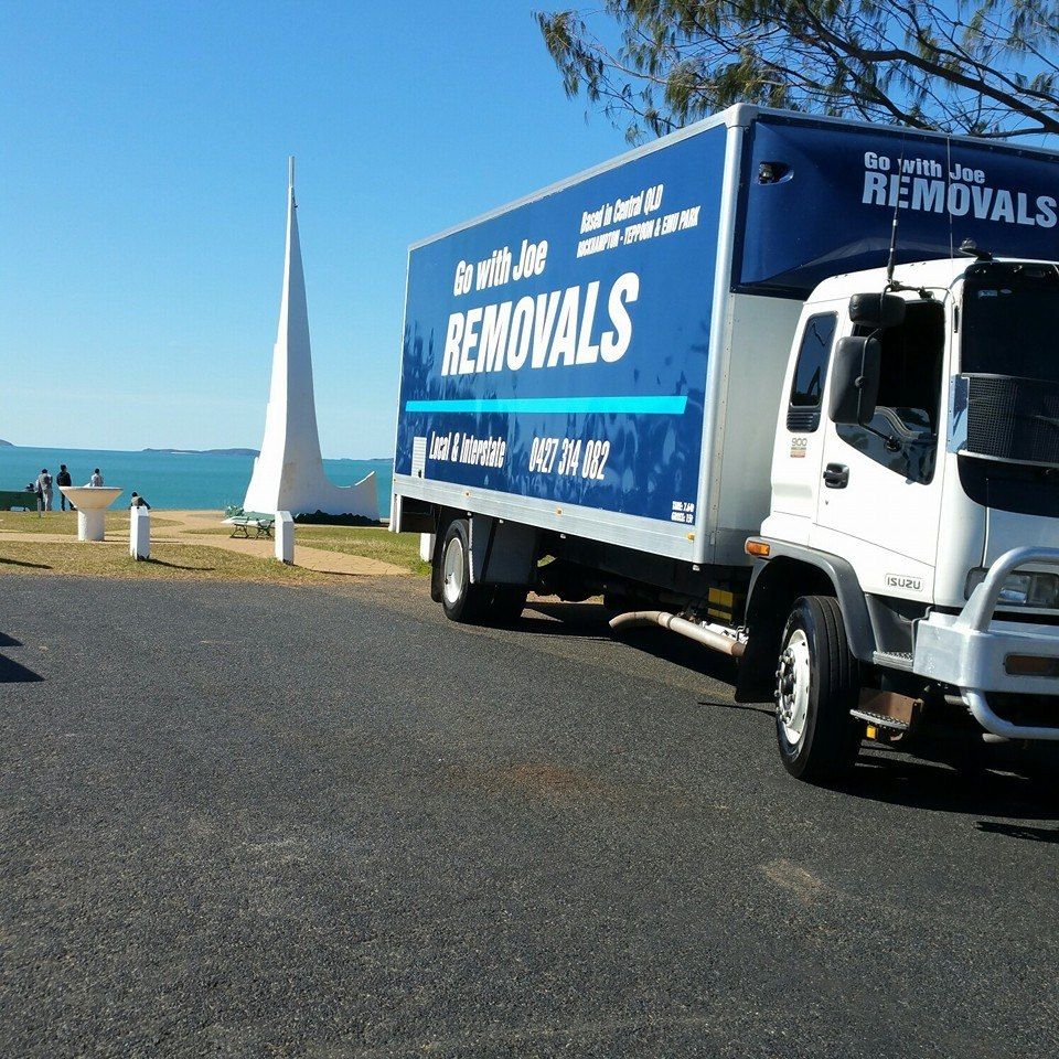Removal truck parked near a beach and monument on a sunny day — Go With Joe REMOVALS in Zilzie, QLD