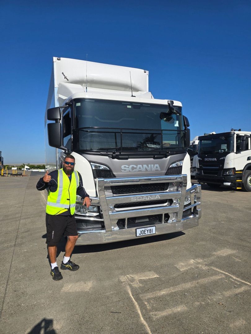 Moving Boxes Stacked in a Room, With a Rolled-up Rug and Potted Plant — Go With Joe REMOVALS in Zilzie, QLD