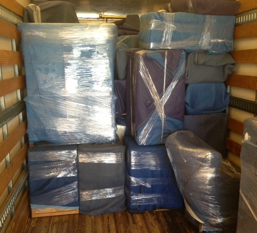Cardboard Box With Rolls of Tape and a Blue Stretch Wrap Dispenser — Go With Joe REMOVALS in Zilzie, QLD