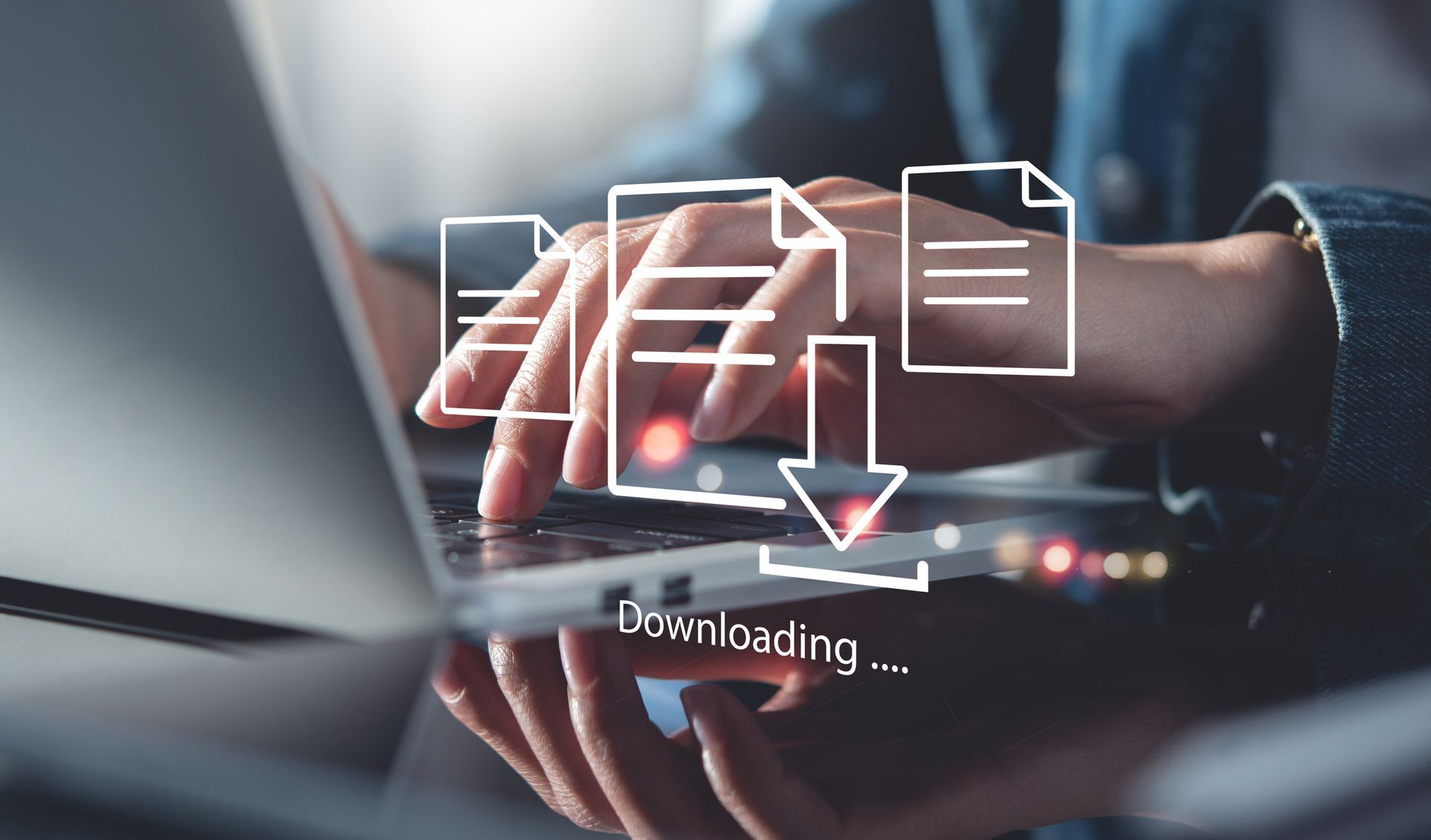 Person typing on laptop with document download icon overlay. Person typing on laptop with document download icon overlay.