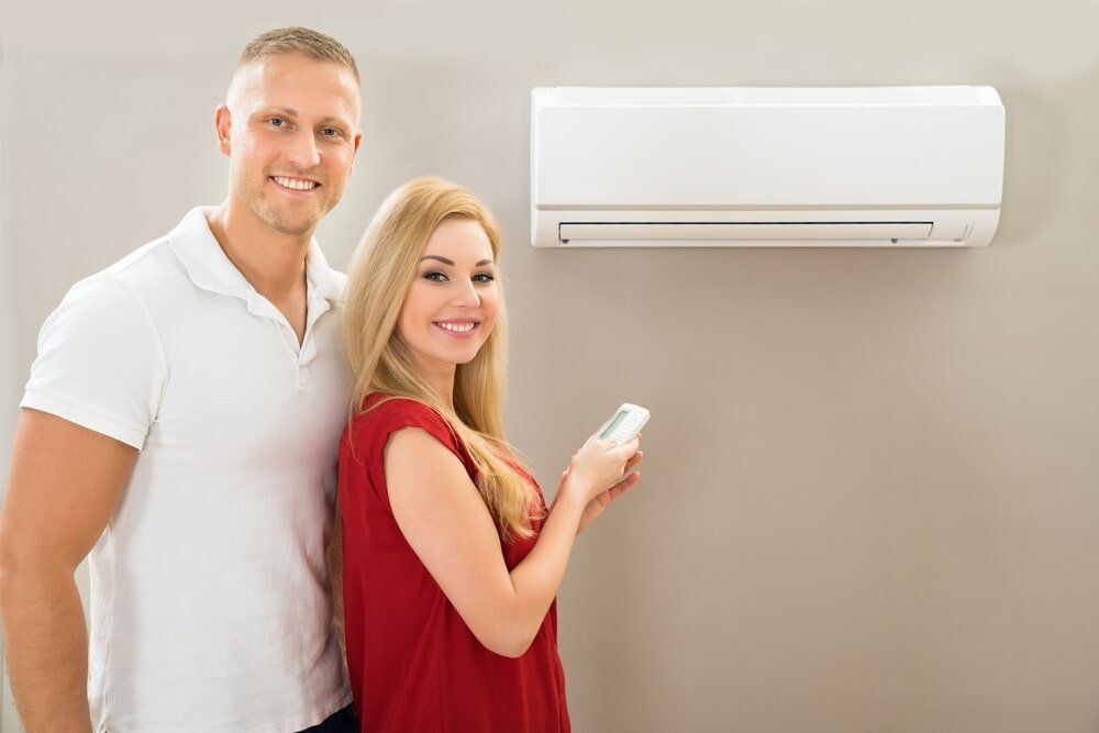 Customer with aircon — Airconditioning and Refrigeration Services in Coffs Harbour, NSW