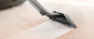 Eco Friend Carpet Clean - Carpet being cleaned with a vacuum cleaner, creating a clean stripe.