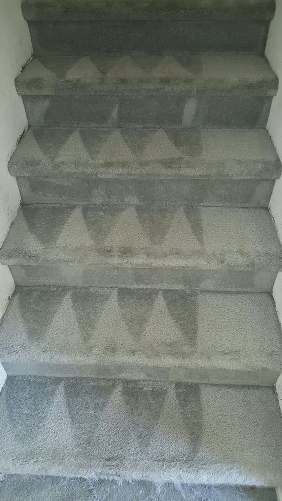 A close up of a set of stairs with a pattern on them.