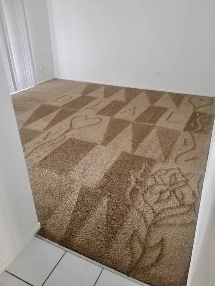 A room with a rug on the floor and a white wall.