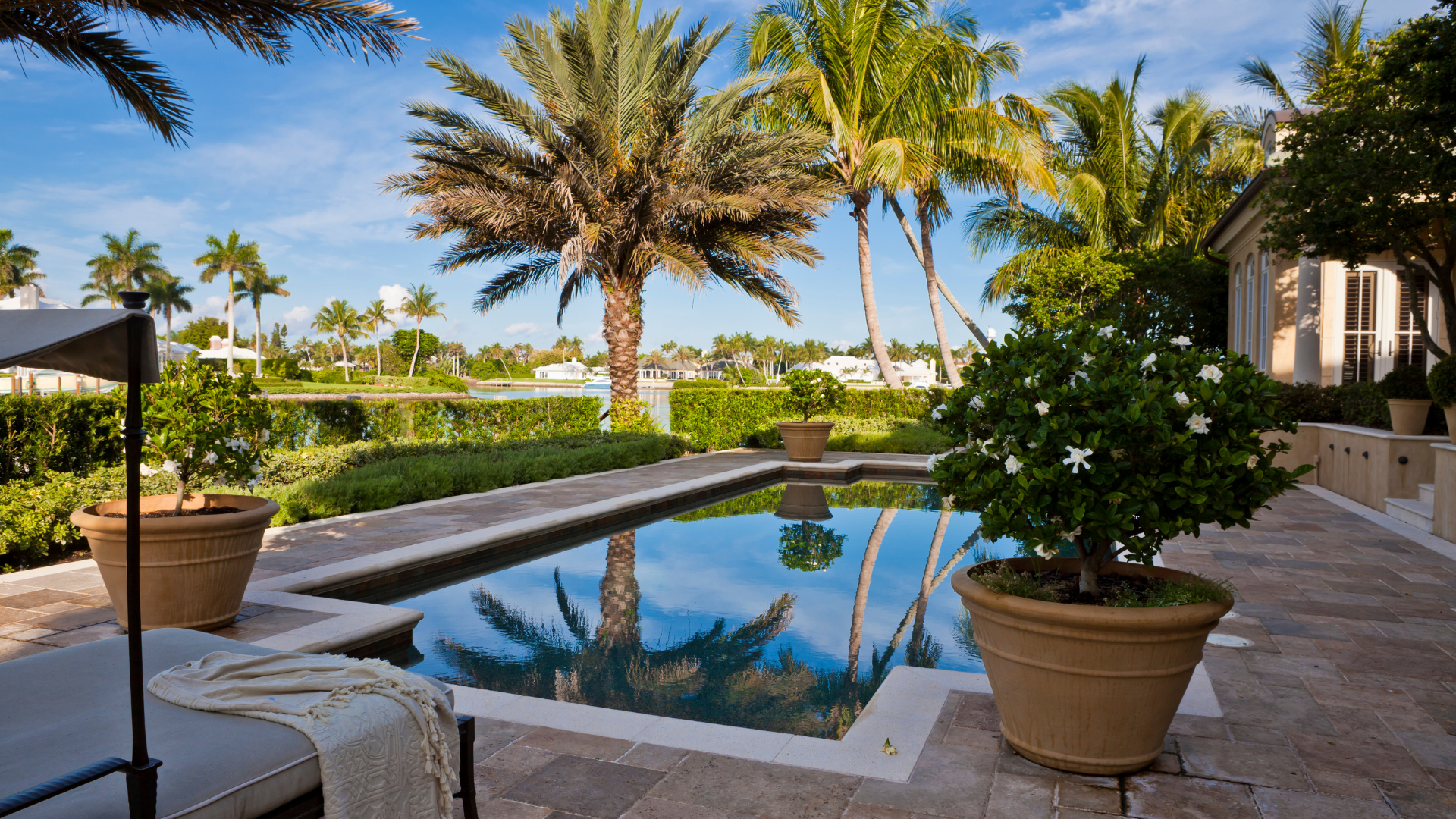 A house with a for sale sign in front of it.