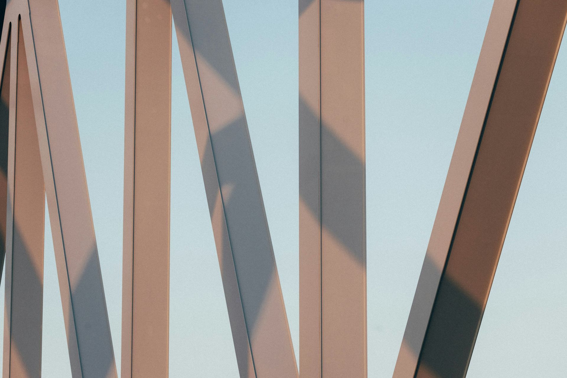 A close up of a bridge with a blue sky in the background