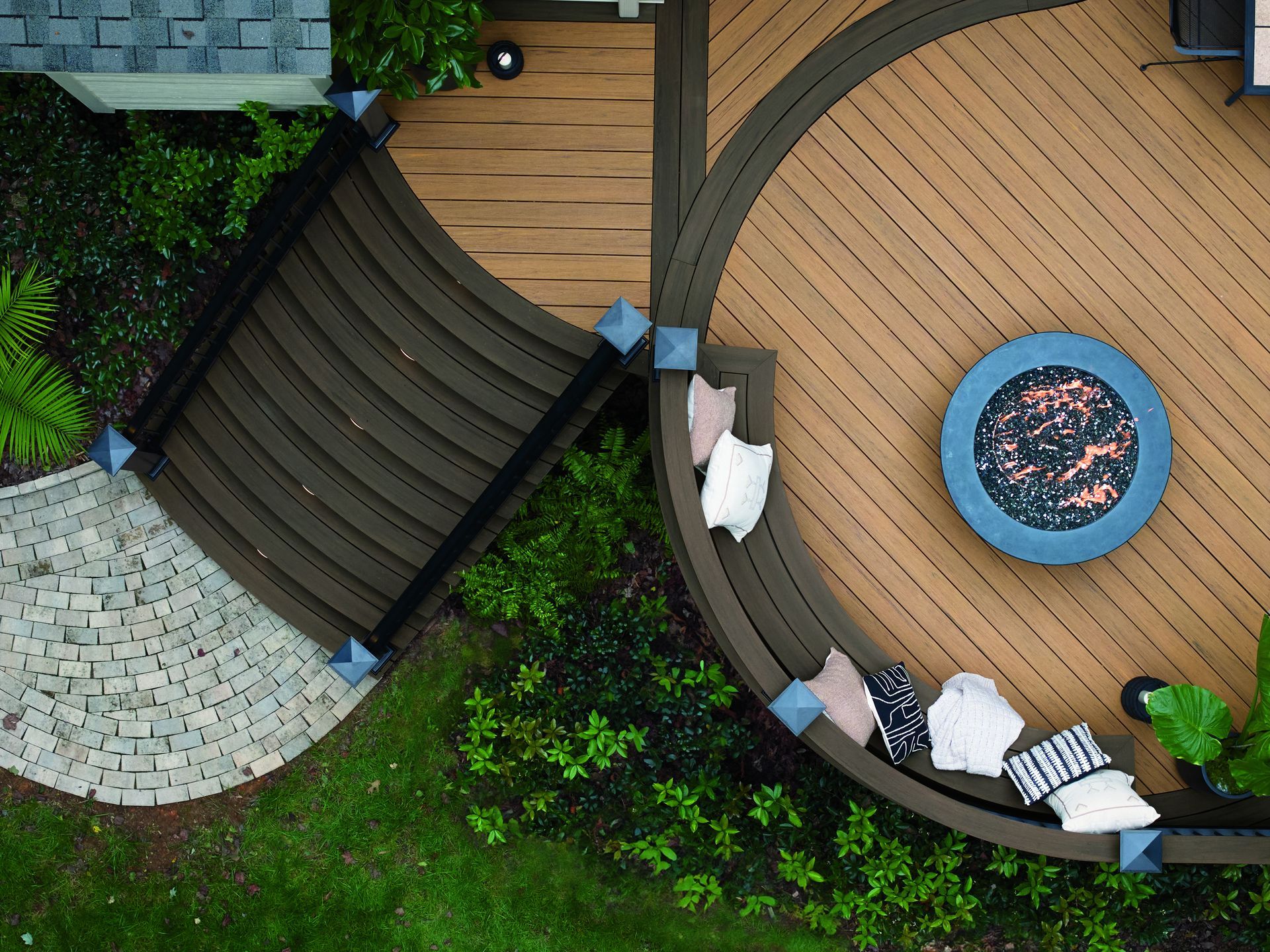 An aerial view of a wooden deck with a fire pit