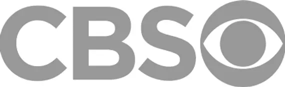 The cbs logo is a gray and white logo on a white background.