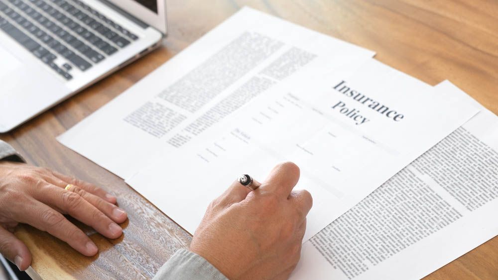 (clueless-looking) person looking at an insurance policy