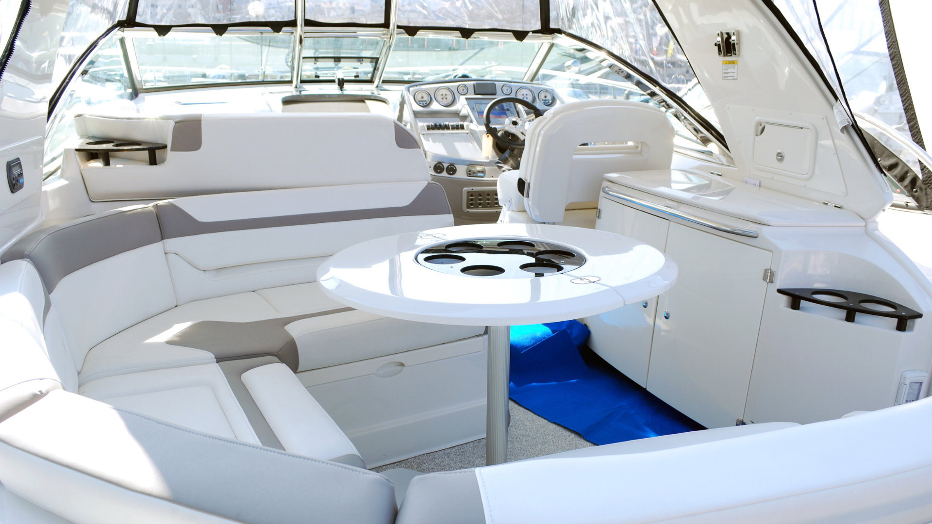 The inside of a boat with a table and chairs