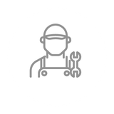 Mechanic holding wrench, wearing hat and overalls.