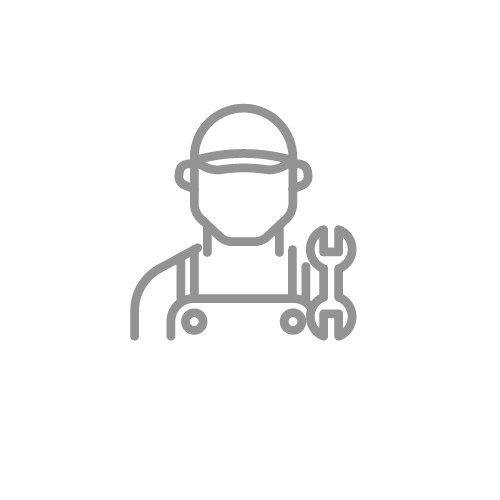 Mechanic holding wrench, wearing hat and overalls.