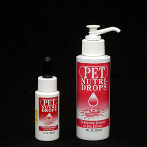 Two bottles of pet nutri drops on a black background