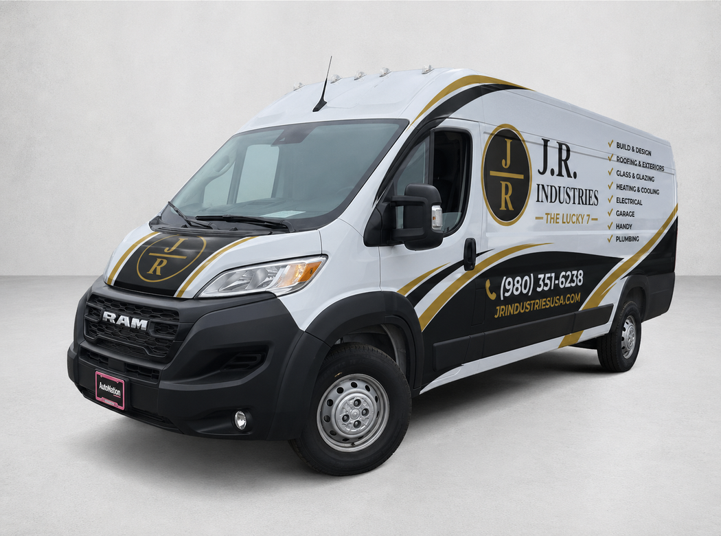 White delivery van with black and gold JR Plumbing branding on a studio background