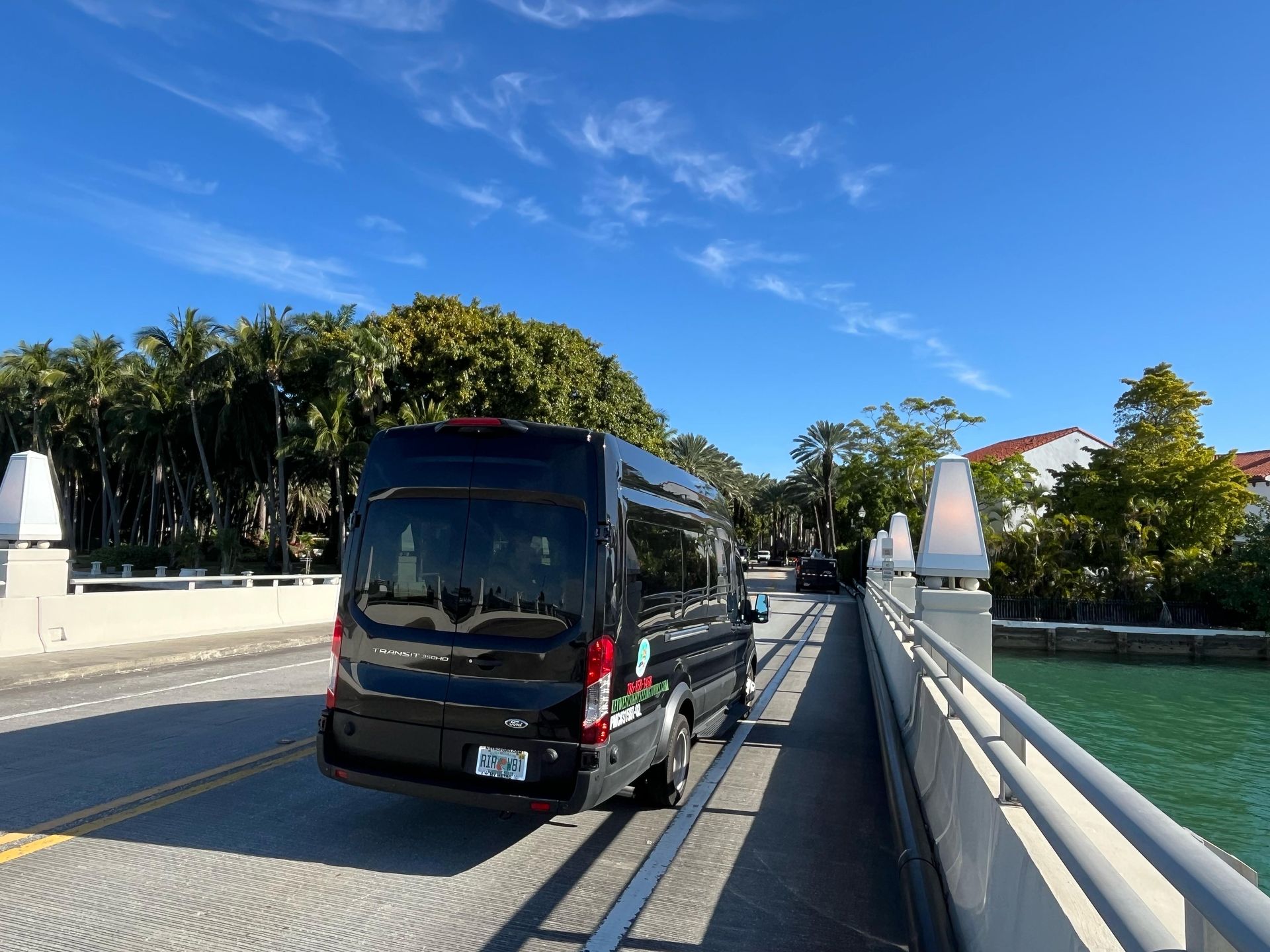 Miami Tour Bus driving into Miami Star Island on the star island City tour of Miami
