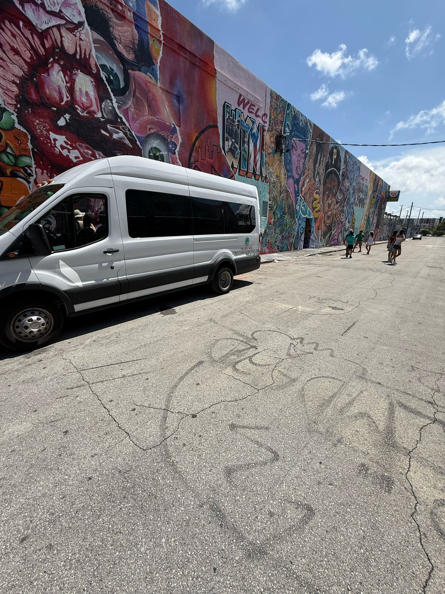 Bus Tour in Miami stopping at Wynwood mural wall during the 5 in 1 City Tour with Miami Tour Bus Promo Code savings