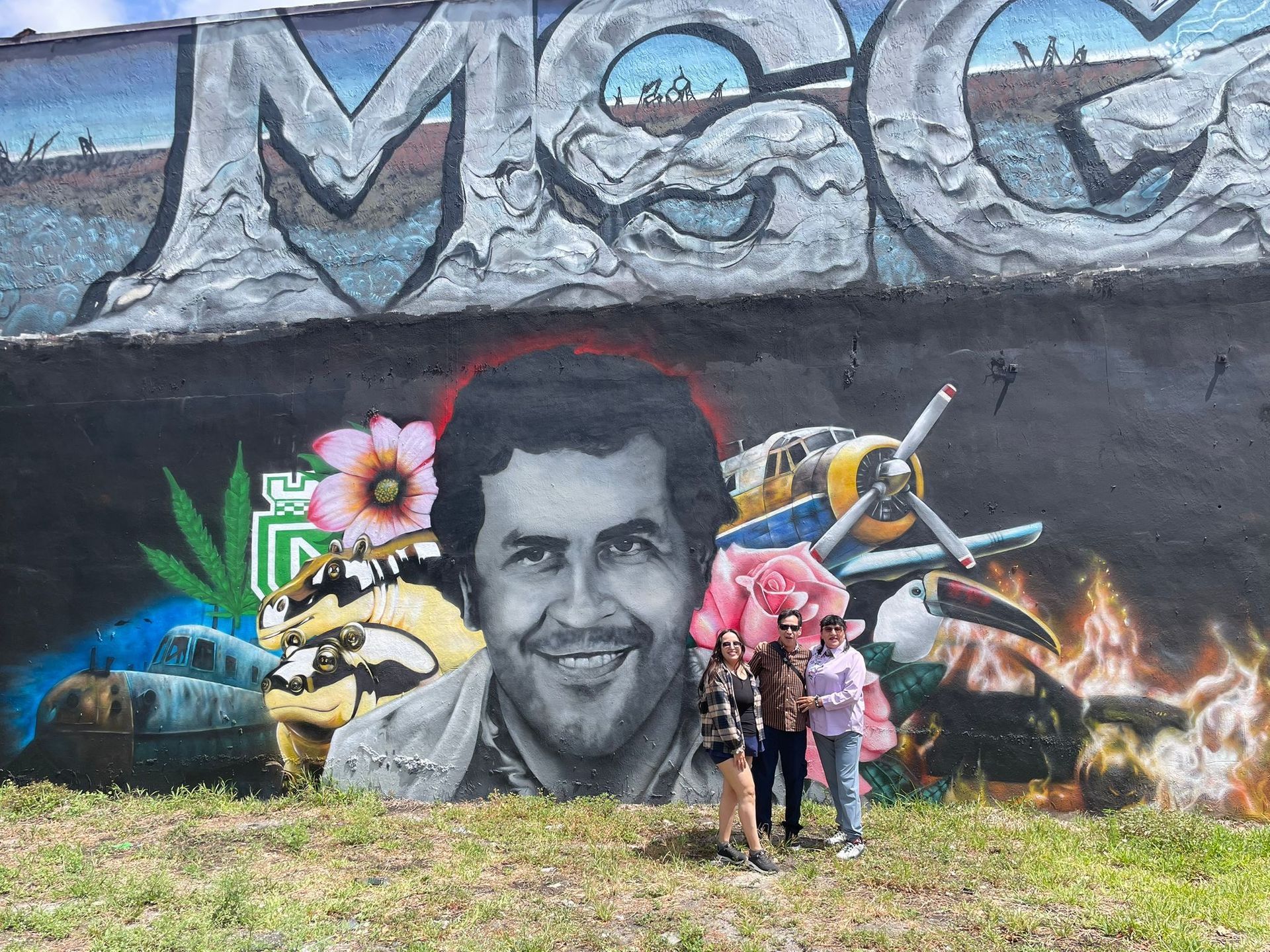 Pablo Escobar mural in the Wyndwood Walls Walking tour taking photos by the Miami Tour Bus tour guide