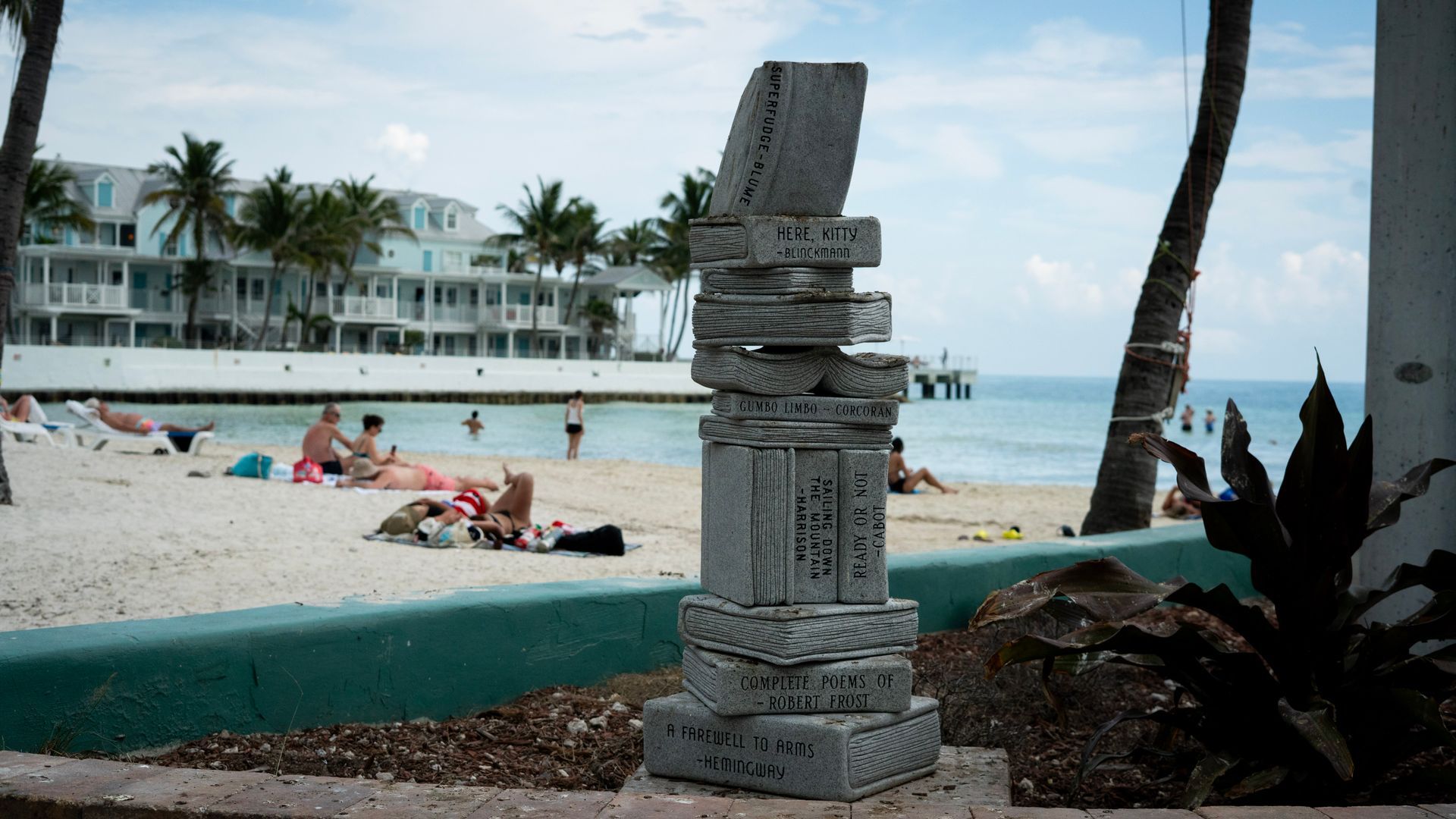 Stacked book sculpture at the beach in Key West, captured during a Florida Keys sightseeing trip from Miami