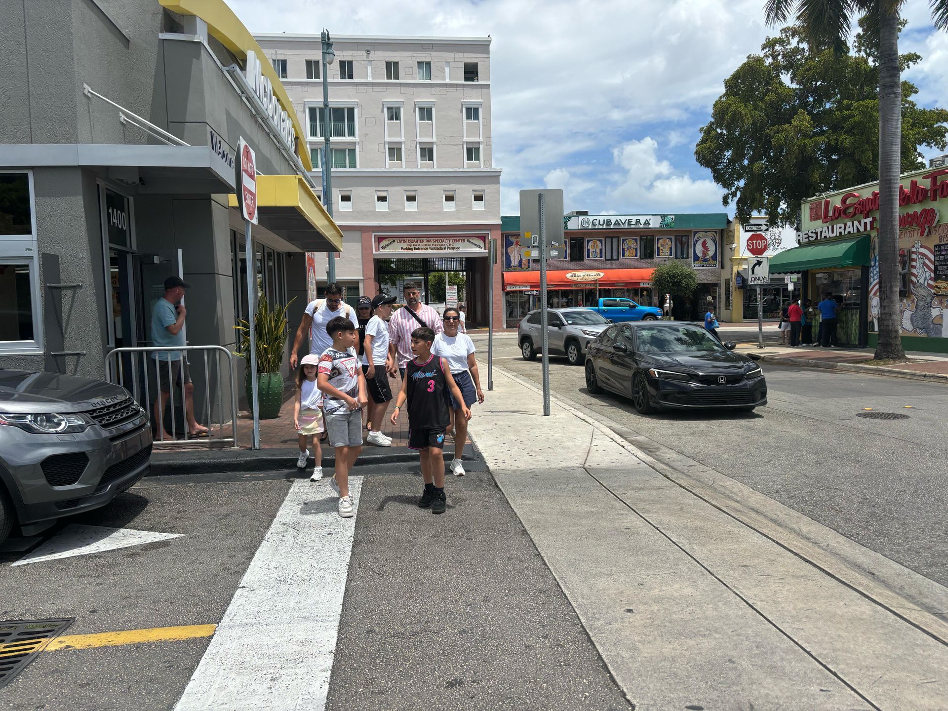 Miami City Bus Tour guests walking through historic Little Havana during a guided sightseeing stop, part of the Tour Bus Miami experience.
