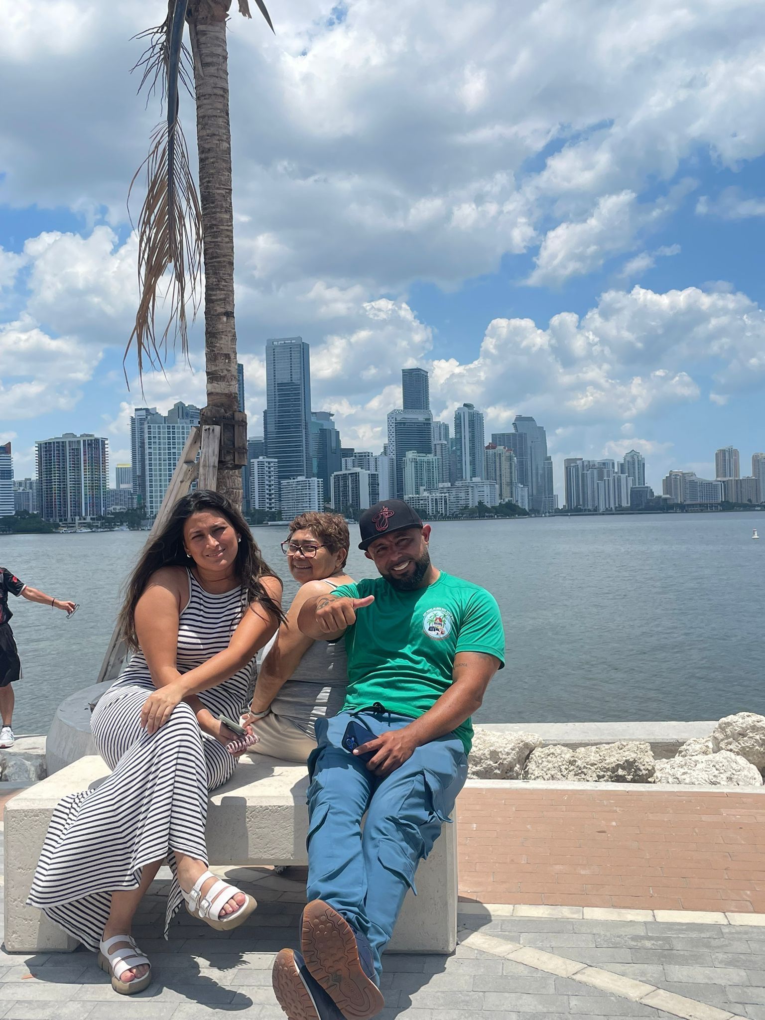 Best City tour in Miami by Miami Tour Bus in the secret Miami Skyline photo spot with tour guide and passengers, laughing for the photo