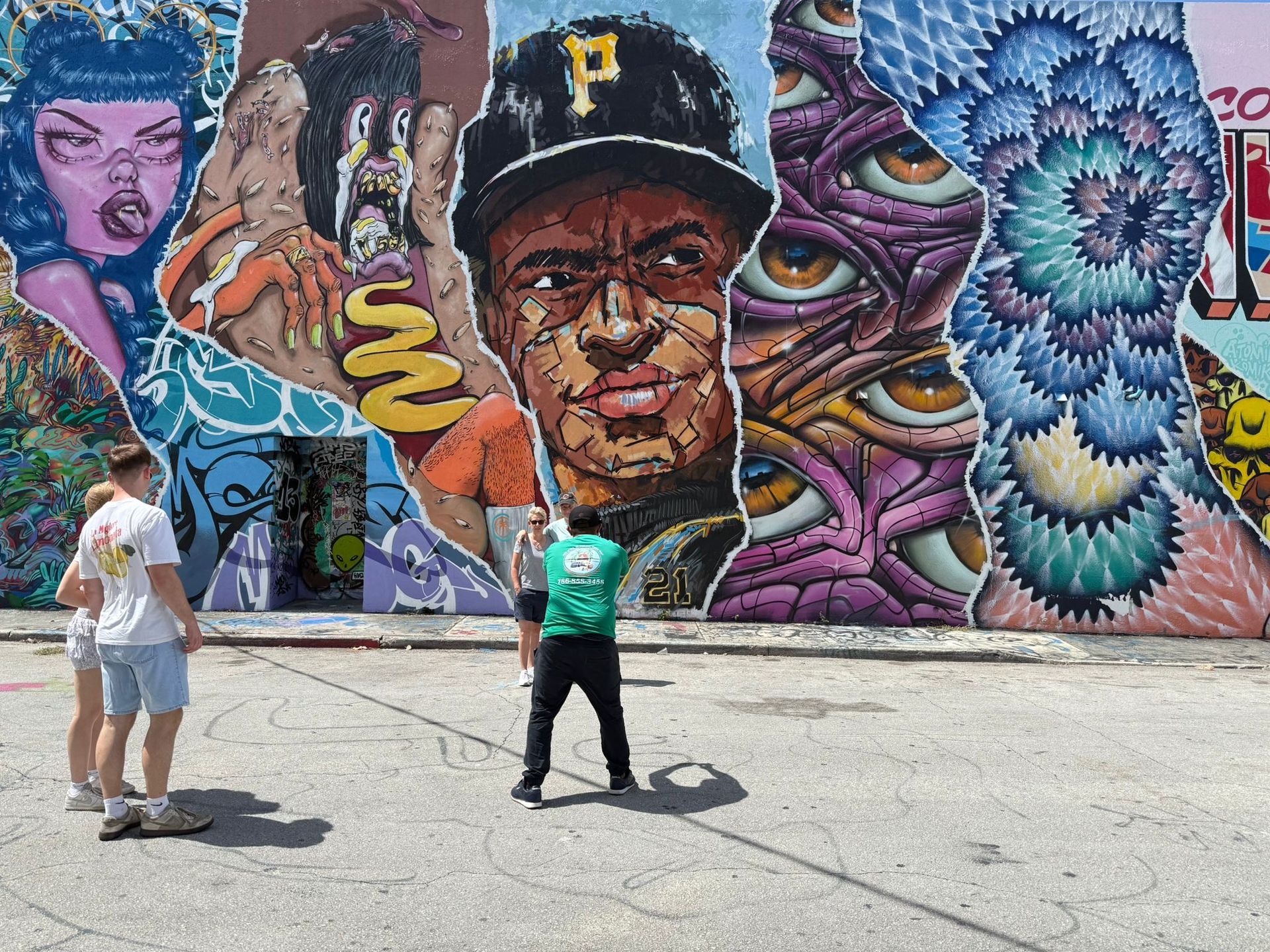 Tour Guide in Wynwood Taking Pictures of the Guest in Wynwoos Walls, part of the Miami Tour Bus 