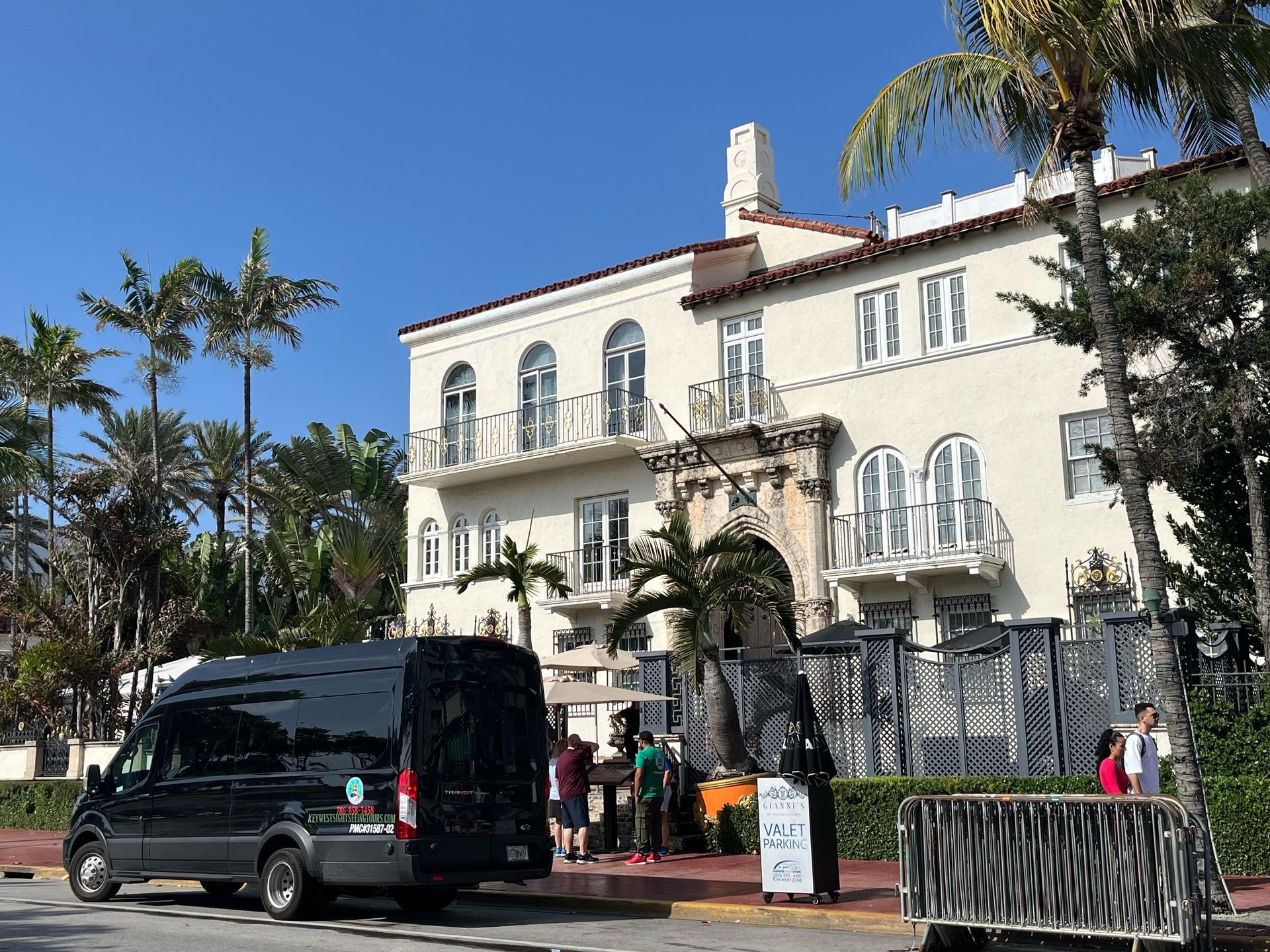 The Bus tour Miami parked at the Versace Mansion