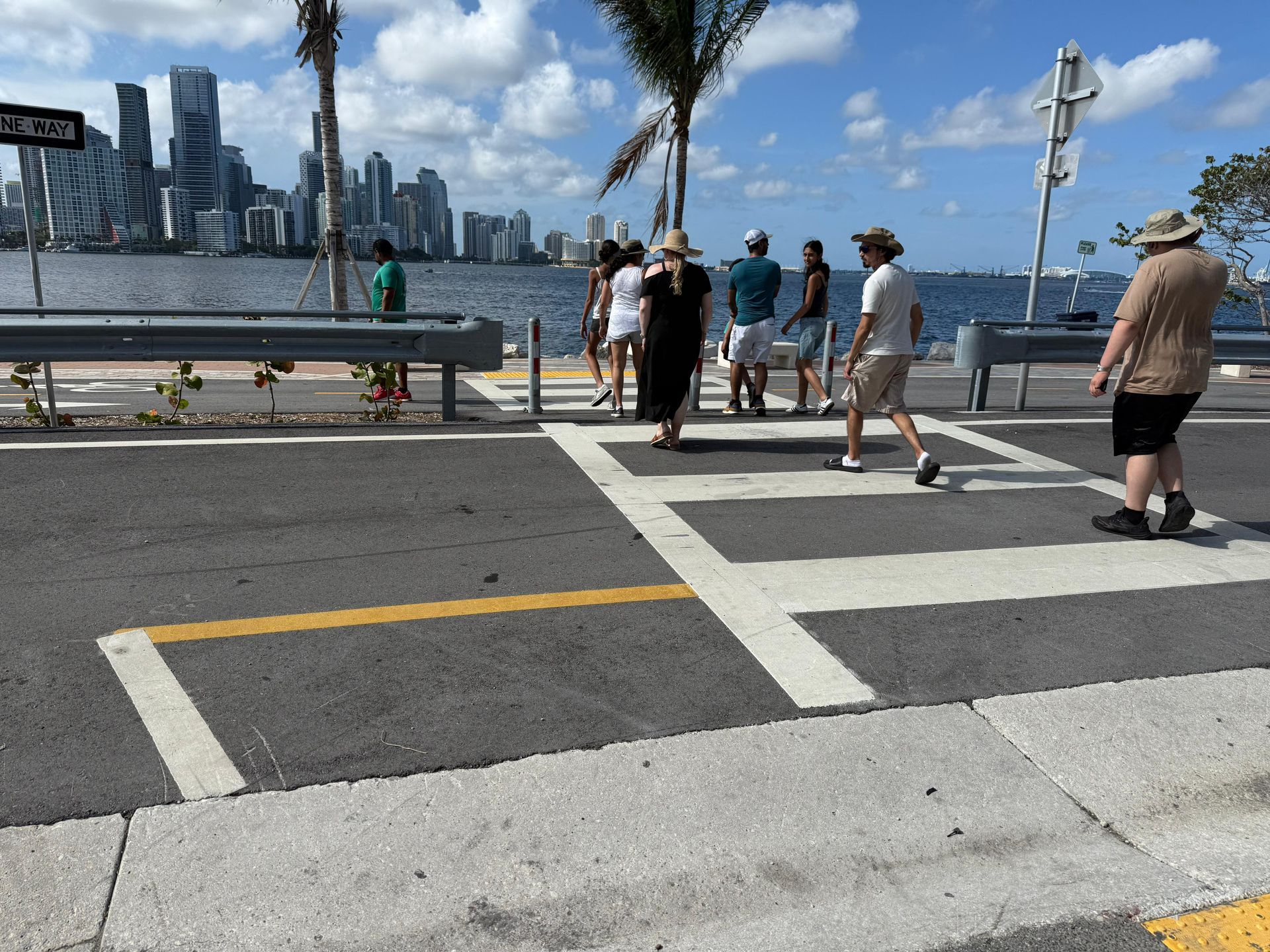 Tour group crossing toward the Miami skyline during the 5 in 1 City Tour with Miami Tour Bus Promo Code