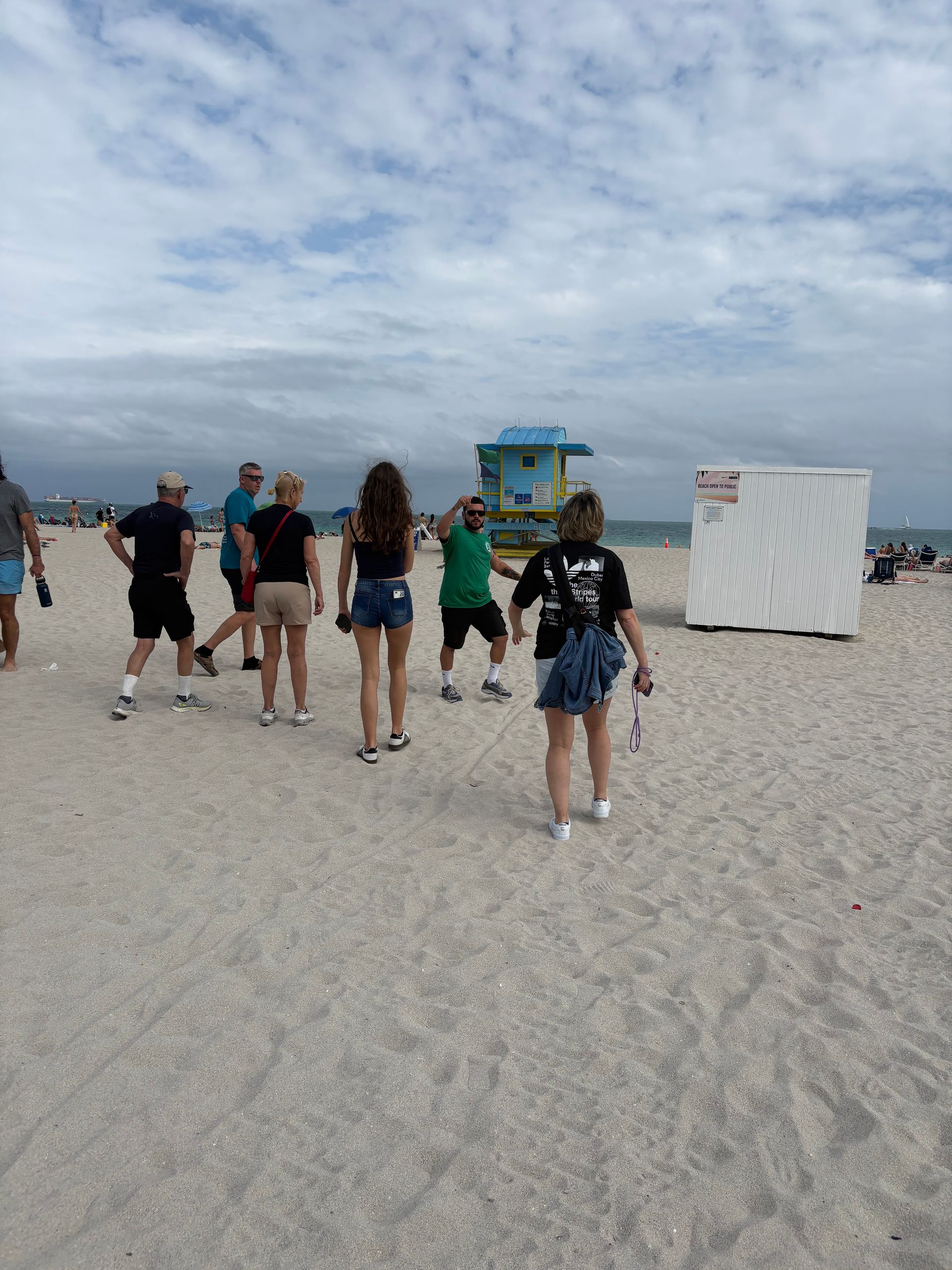 Tourists walking through South Beach on a Sightseeing tour
