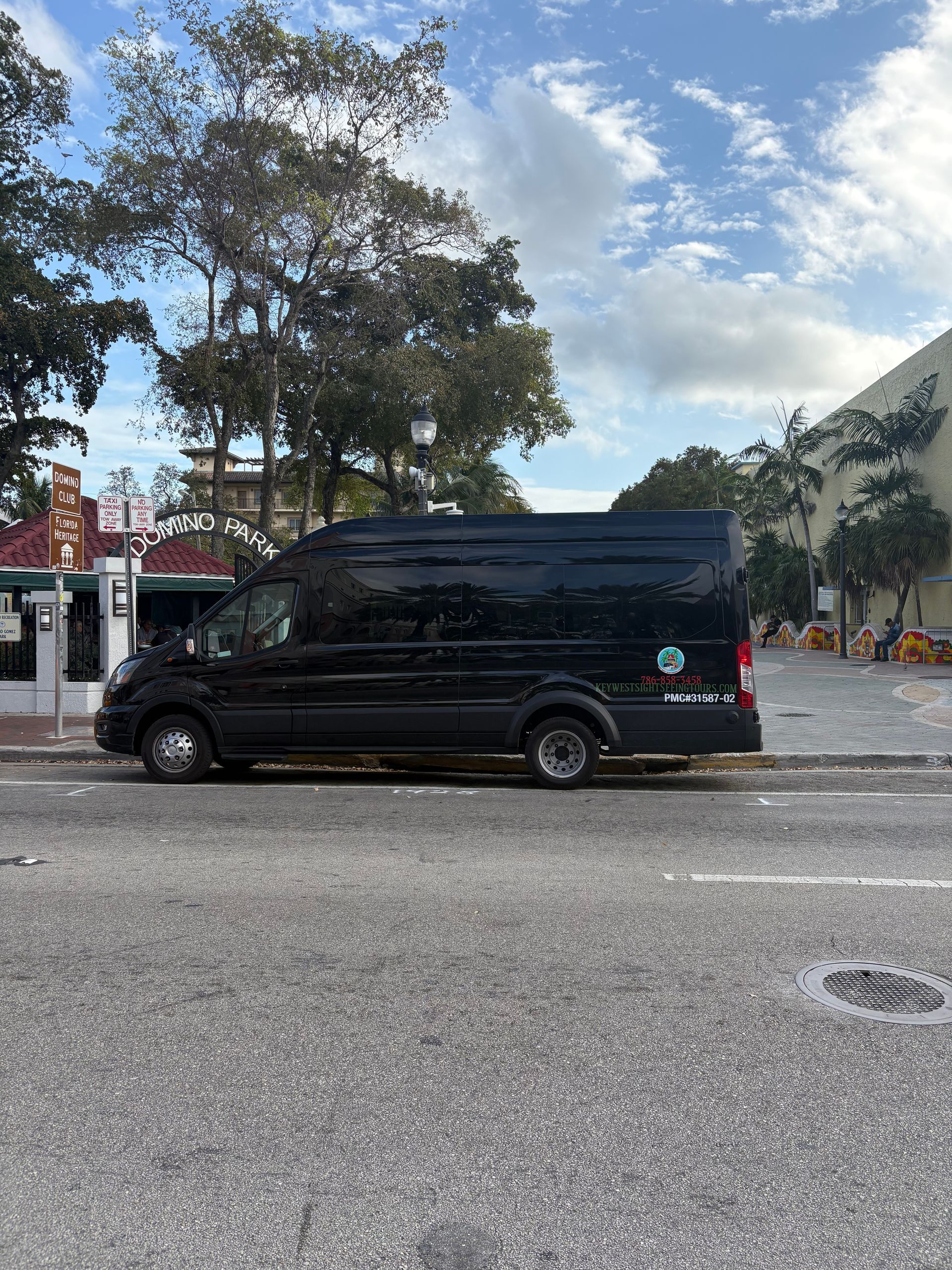 Miami sightseeing bus parked near Domino Park
