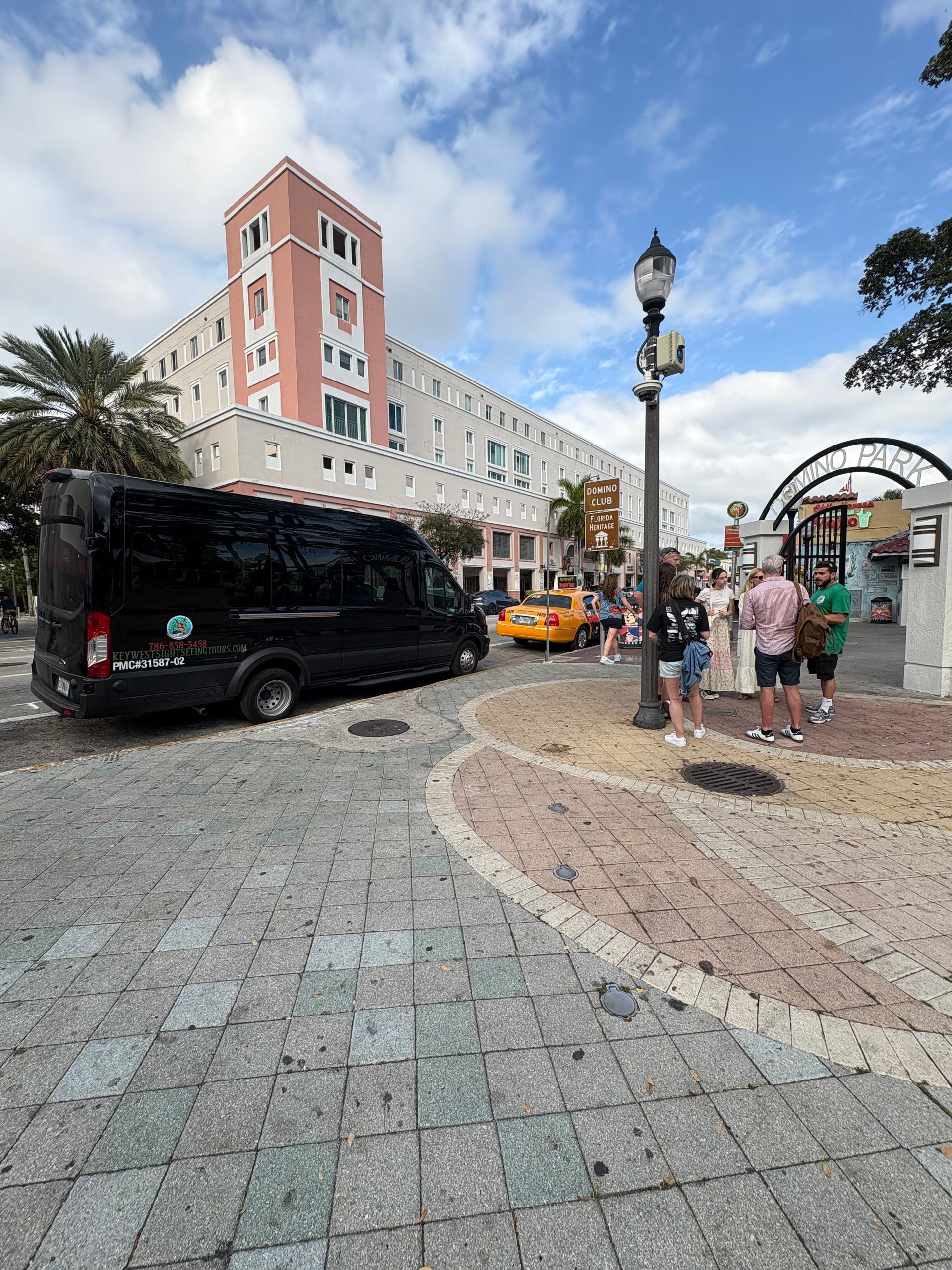 Miami sightseeing bus parked near Domino Park with guest 
