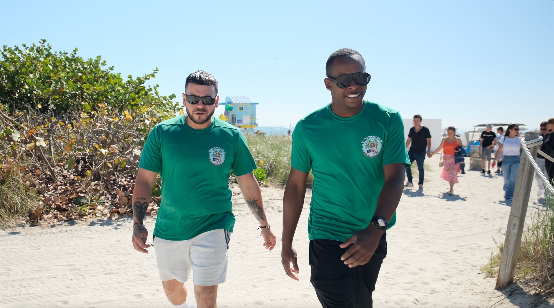 Tour Guide and driver walking in South Beach under the Sunshine