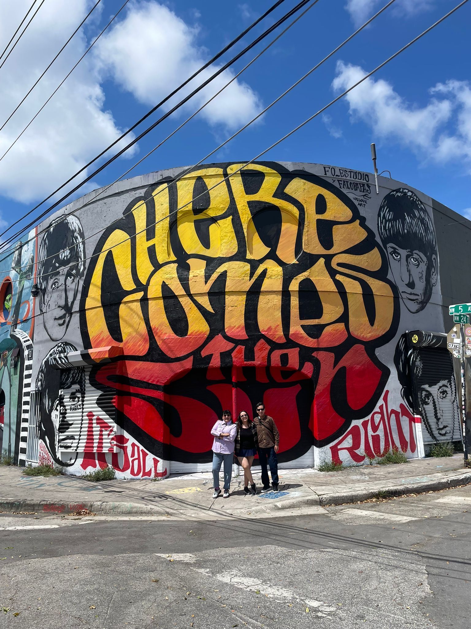 Guest taking pictures in Wynwood Walls part of the Miami Tour Bus hop on hop off city tour