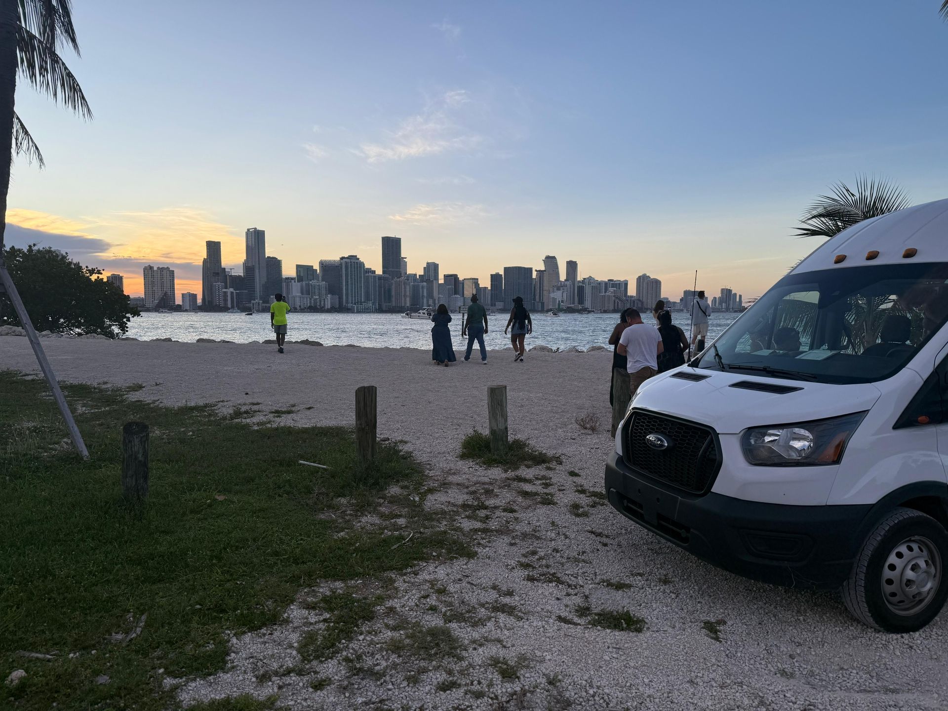Miami Skyline Sunset Spot Sightseeing Night Bus parked in Biscayne Bay