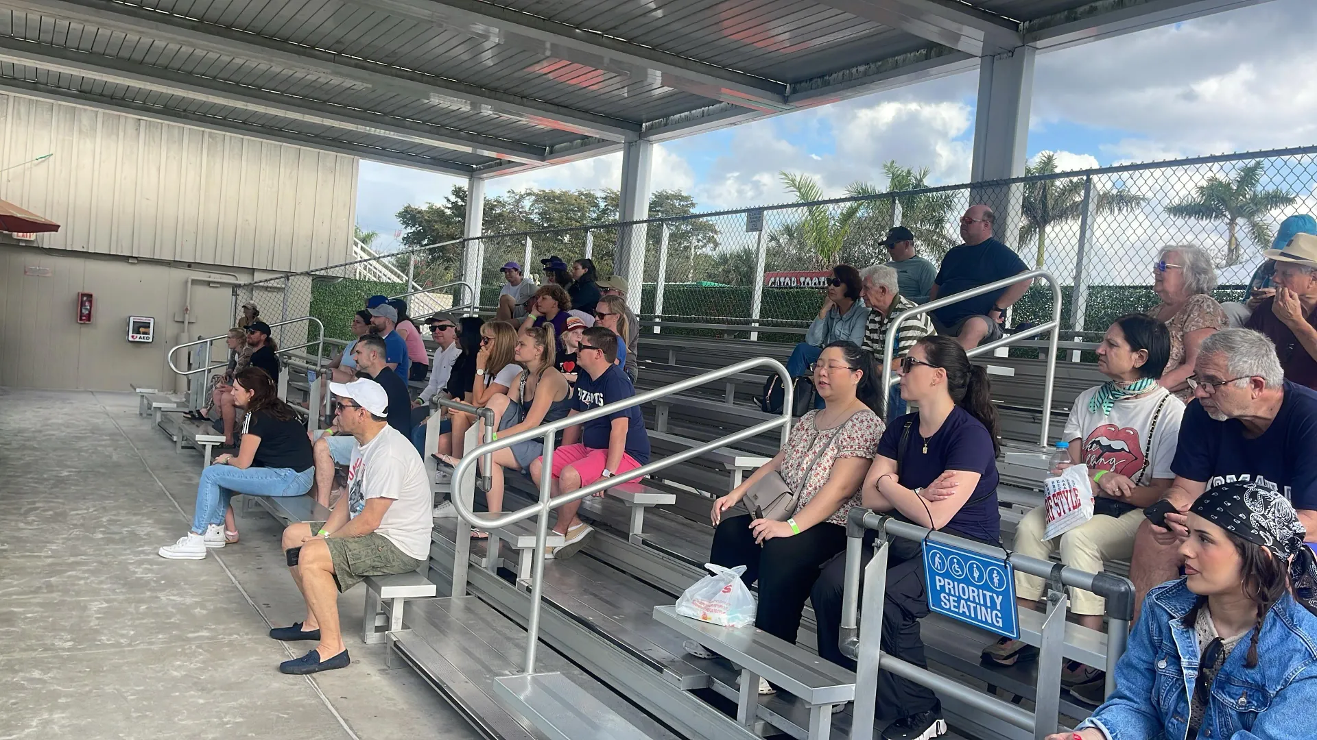 Visitors watching an alligator show during an Everglades airboat tour from Miami in the Florida Everglades.