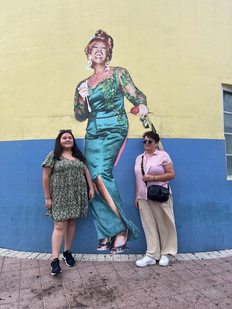 Passengers taking a Selfie with Celia Cruz Mural in little Havana, part of the Miami City tour