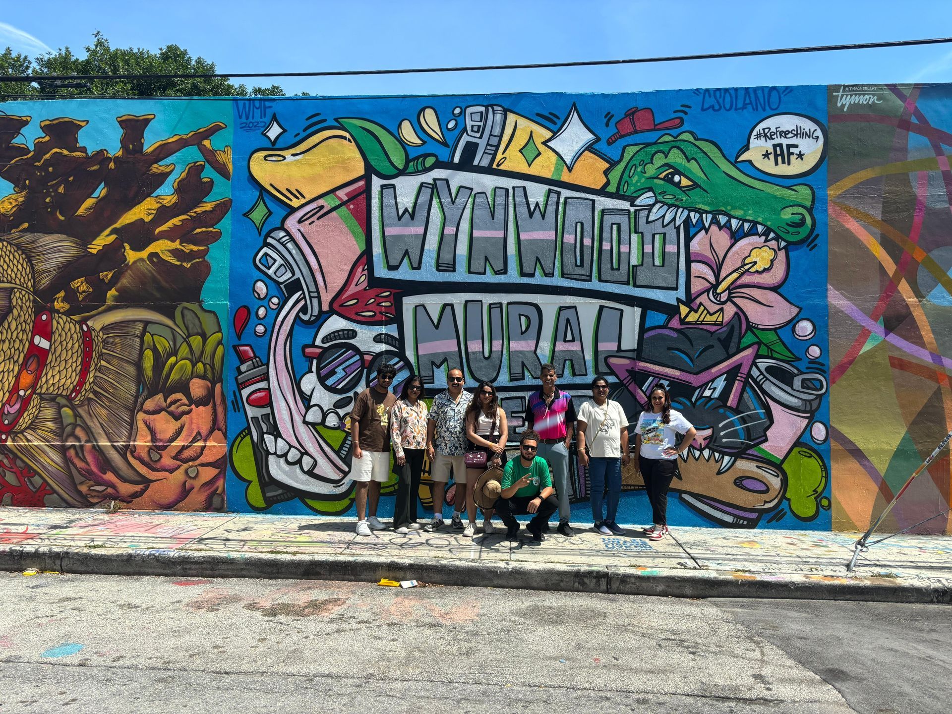 Miami Tour Bus Promo Code guests enjoying a free photo stop at the Wynwood Walls as part of their discounted city tour
