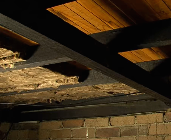 Partially completed underfloor crawl space insulation