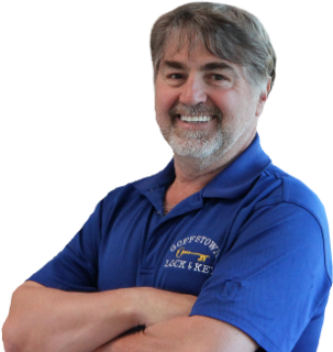 A man in a blue shirt with the word lock on it