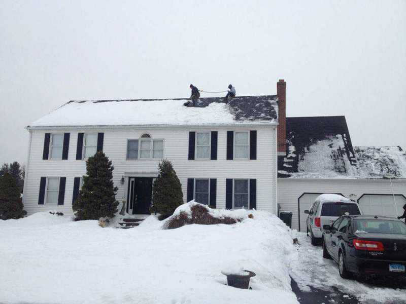 During Roof Snow Removal in Killingworth, CT - Martin Roofing & remodeling llc