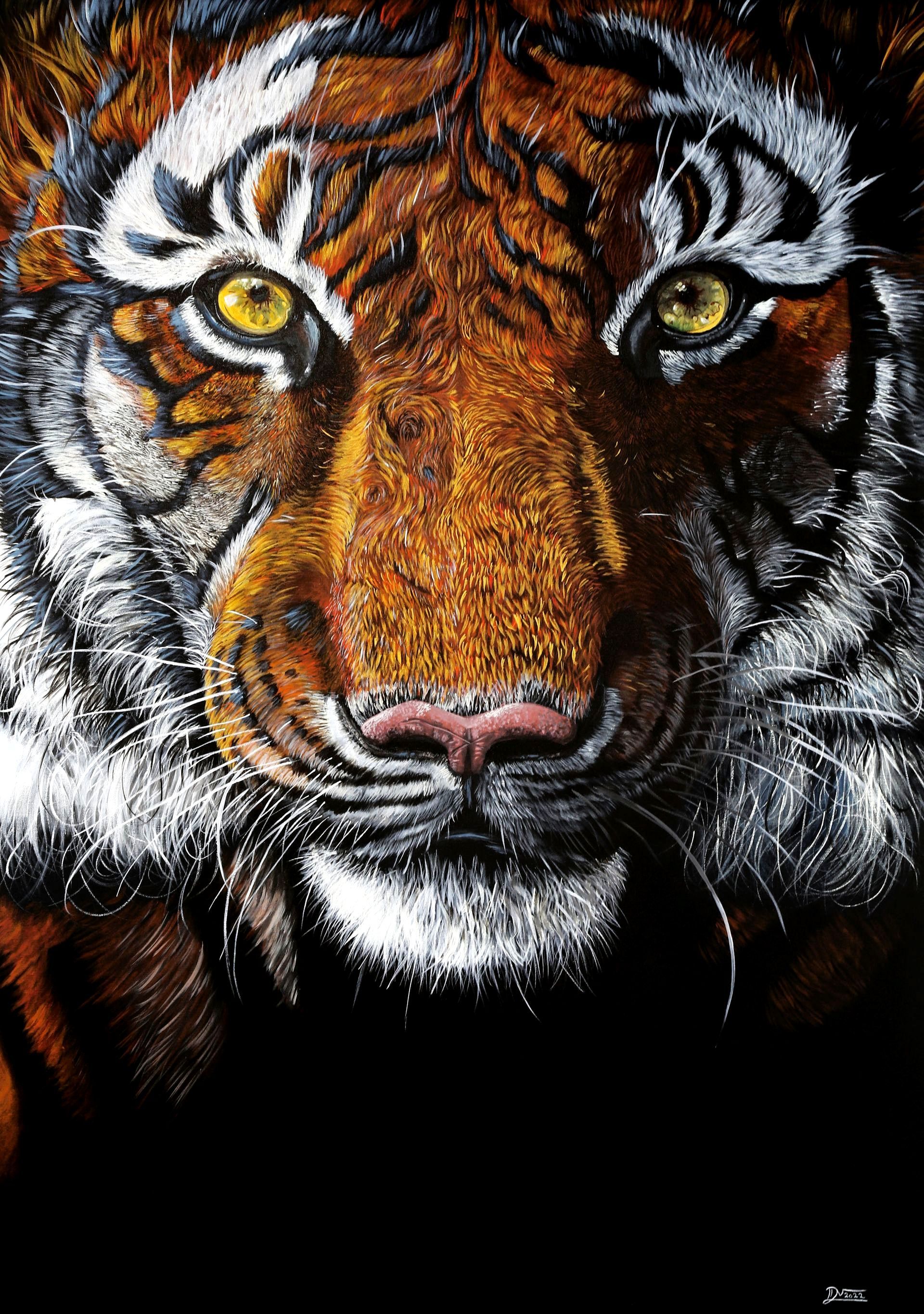 A close up of a tiger 's face with yellow eyes.