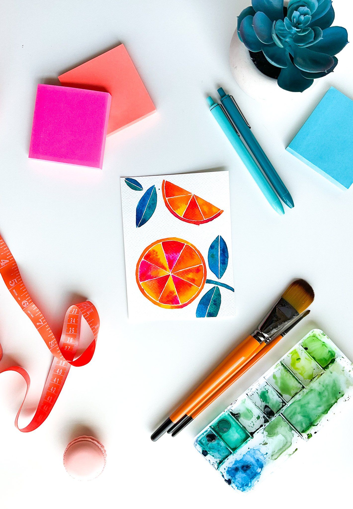 Flatlay vivid watercolor painting of oranges