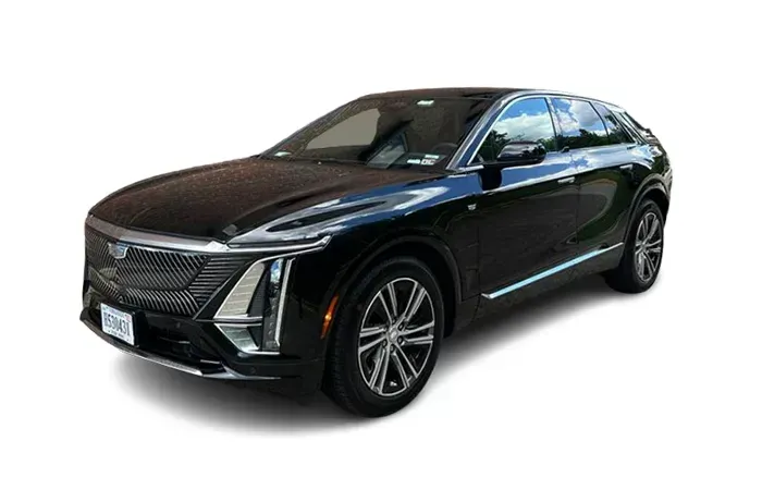 Black Cadillac Lyriq SUV parked on a white background, angled view.