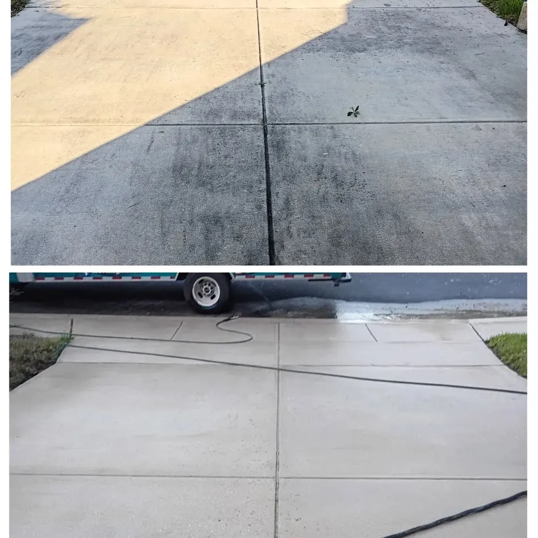 A split-screen comparison of a concrete driveway before and after professional power washing, showing dirt being removed.