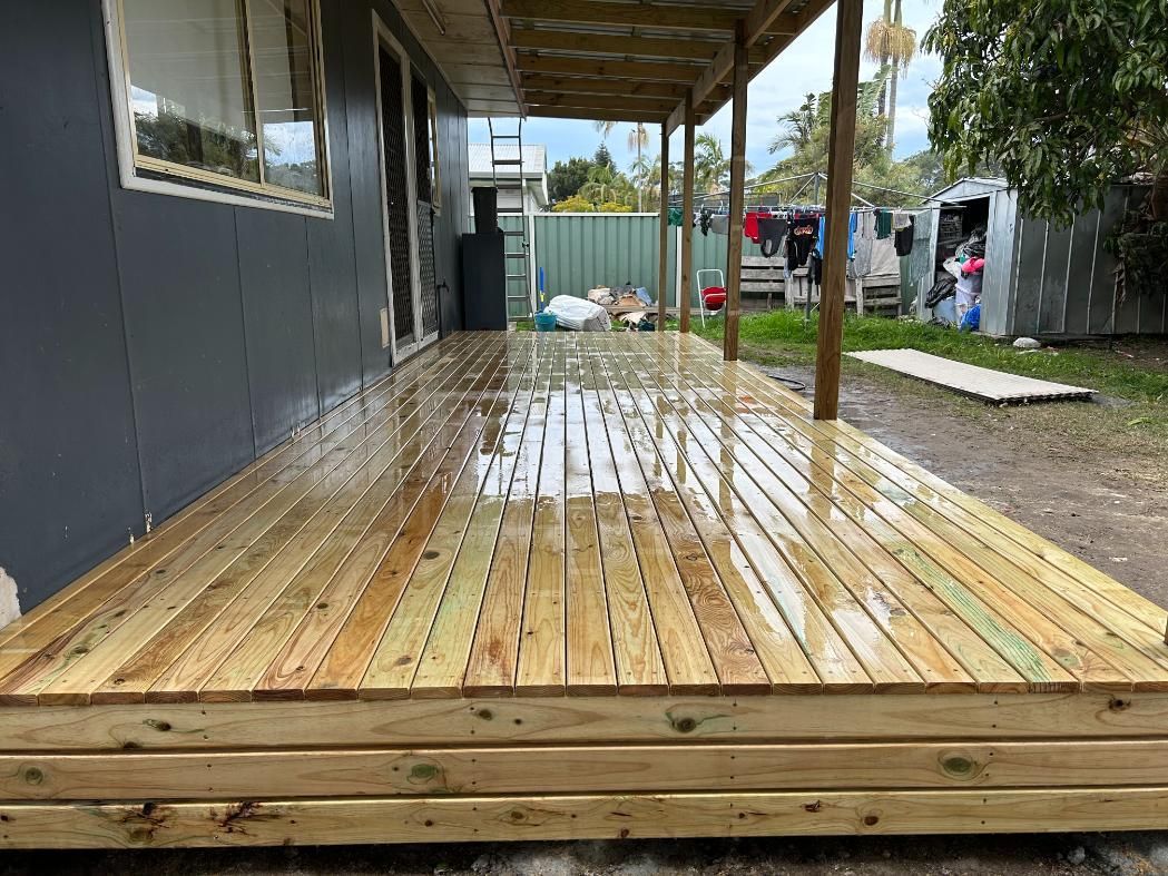 A Wooden Deck is Being Built in Front of a House — BK Build Group in Coffs Harbour, NSW