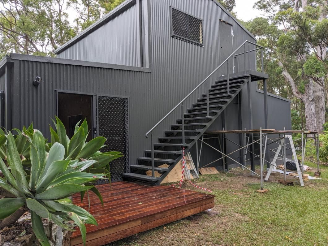 A House With Stairs Leading Up to the Second Floor is Being Built — BK Build Group in Sawtell, NSW
